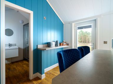 A kitchen with a sink and a shower visible in the adjoining room at The Grays in North Berwick
