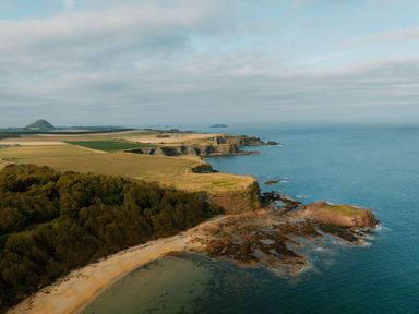 A coastal view featuring cliffs and the sea at The Grays in North Berwick