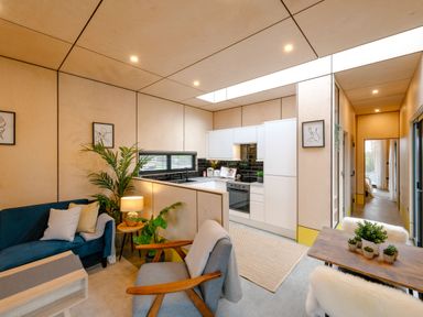 A living room with a sofa and kitchen at Orka 1.0 (Pet) Dumfries
