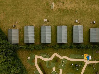 An outdoor area with tents and a mini golf course at Hurricane Lodge in Fair Oak