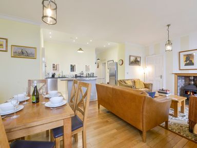 A living room with a dining area and kitchen at The Old Signal House Torpoint