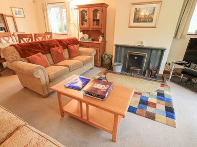 A living room with furniture and a fireplace at Thrang View in Chapel Stile