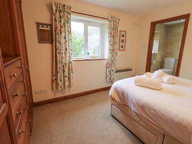 A bedroom with a bed and a window at Thrang View in Chapel Stile