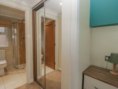 A bathroom with a shower, toilet, and sink at High Lake View Lodge White Cross Bay near Troutbeck Bridge