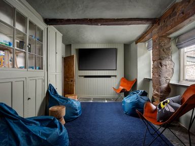 A snug with TV and seating at Whalesborough Farmhouse Spa Marhamchurch