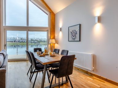 A dining room with a table and chairs at Tranquillity 4 (Pet) in Carnforth