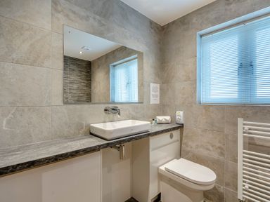 A bathroom with a sink and a mirror at Tranquillity 4 (Pet) Carnforth