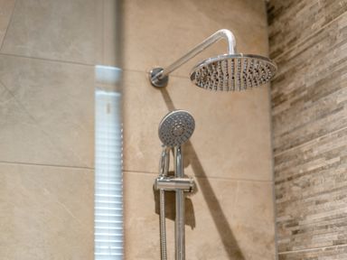 A shower head and handheld shower in a bathroom at Tranquillity 4 (Pet) Carnforth