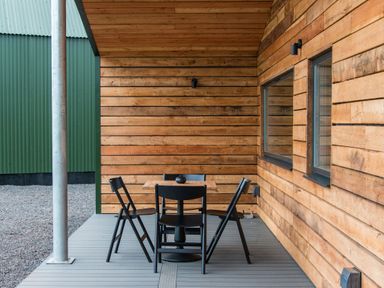 An outdoor seating area with a table and chairs at The Telfer in North Berwick