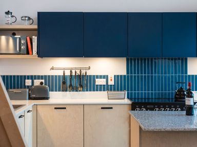 A kitchen with cabinets and appliances at The Telfer in North Berwick
