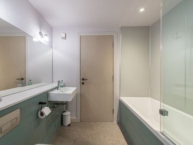 A bathroom with a sink and bathtub at The Telfer in North Berwick