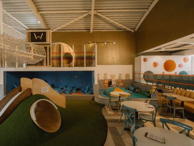 A play area with slides and seating at The Telfer in North Berwick
