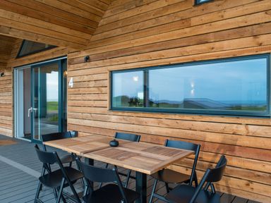 A terrace with a table and chairs at The Irvine in North Berwick