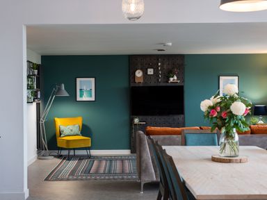 A living room with a sofa and dining table at The Irvine in North Berwick