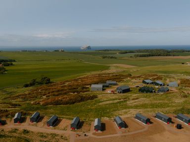 An outdoor area with buildings and hills at The Irvine in North Berwick