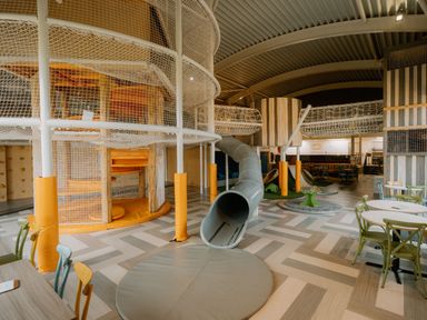 A play area with climbing structures and seating at The Irvine in North Berwick