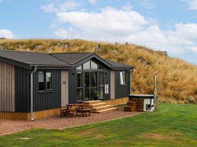 A building with wooden steps and a hot tub at The Townsend in North Berwick