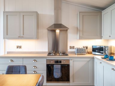 A kitchen with appliances and cabinets at The Townsend in North Berwick