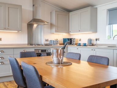 A kitchen with a dining table and chairs at The Townsend in North Berwick