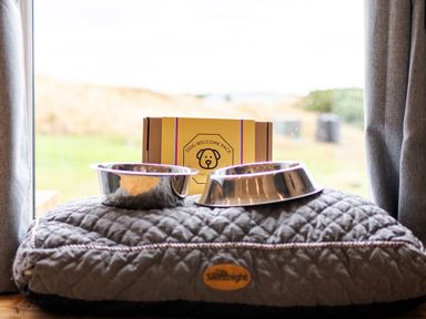 A dog bed with bowls and a welcome pack at The Townsend in North Berwick