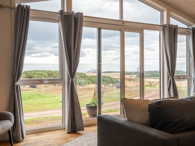 A living room with a view of the landscape at The Townsend in North Berwick