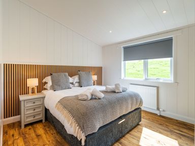 A bedroom with a bed and bedside table at The Townsend in North Berwick