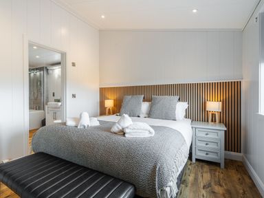 A bedroom with a bed and bedside table at The Townsend in North Berwick