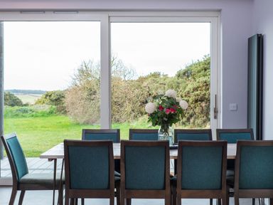 A dining room with a table and chairs at The Laidlaw Spa North Berwick