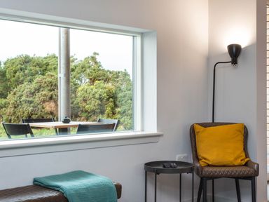 A living room with a window and a chair at The Laidlaw Spa North Berwick