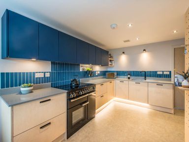 A kitchen with cabinets and stove at The Laidlaw Spa in North Berwick