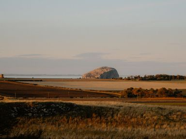 A landscape view featuring a rock formation and fields at The Laidlaw Spa in North Berwick