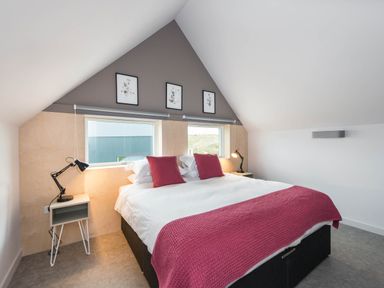 A bedroom with a bed and bedside table at The Laidlaw in North Berwick