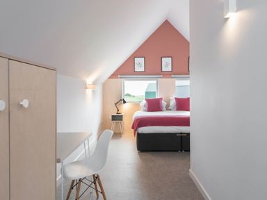 A bedroom with a bed and desk at The Laidlaw in North Berwick