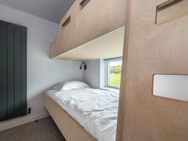 A bedroom with a bed and a window at The Laidlaw in North Berwick