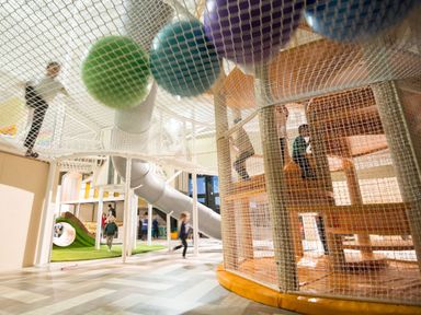 A play area with children climbing and sliding at The Laidlaw North Berwick