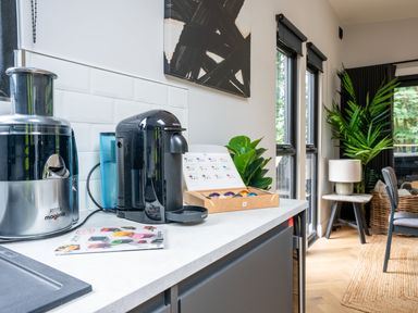 A kitchen with a juicer and coffee machine at Cabin 2.0 in Dumfries