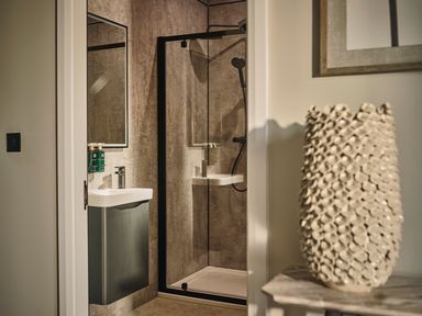 A bathroom with a shower and sink at Cabin 2.0 Deluxe in Dumfries