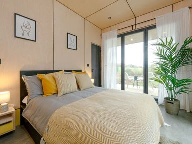A bedroom with a bed and window at Orka Duo 2.0 (Pet) Dumfries