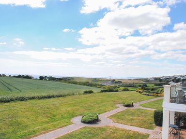 A landscape view of fields and sea at 8 Thurlestone Beach in Kingsbridge