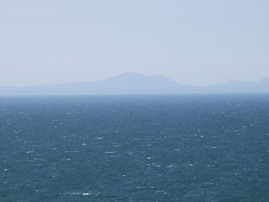 A view of the sea and distant mountains at Llwyn Derw in Talybont