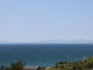 A view of the sea and hills at Llwyn Derw in Talybont