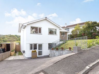 A house with windows and front yard in Orchard View St. Austell