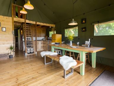 A dining room with a table and chairs at Badger - Luxury Glamping Retreat in Battle