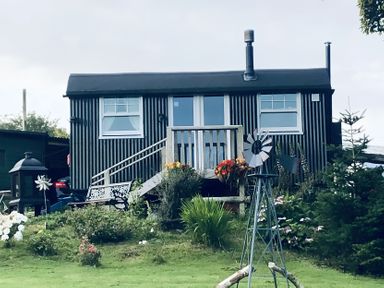 A cabin with steps and garden features at Tylands in Camelford