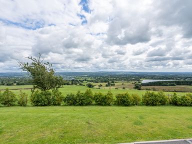 A landscape view with trees and fields at Valley View Lodge 1 in Preston