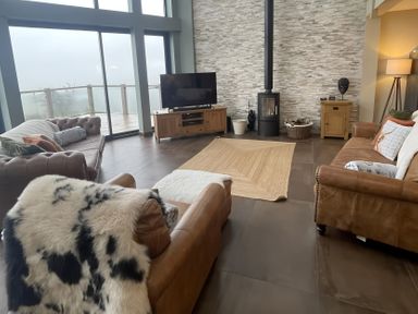 A living room with sofa and television at Pendle View Preston