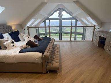 A bedroom with a bed and view at Pendle View in Preston