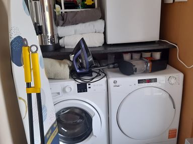 A laundry room with a washing machine and dryer at The Farmhouse in Omagh