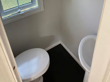A bathroom with a toilet and sink at Caravan 38 Newport
