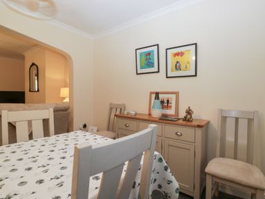 A dining room with a table and chairs at Mables in Wigton